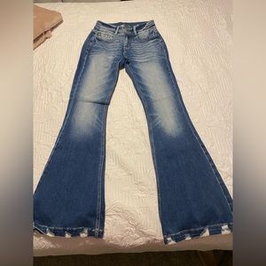 Flared KanCan jeans size 26 distressed bottom
